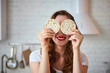 Young Woman Eating Rye Cracker Crisp Bread In The Kitchen. Healthy Lifestyle. Health, Beauty, Diet Concept Stock Photos