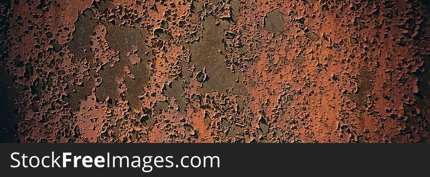 Rusty metal sheet surface coated with decaying paint. Web banner