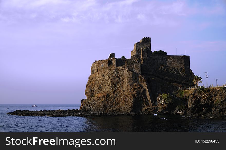 Aci Castello &#x28;Sicilian: Jaci Casteḍḍu&#x29; is a city and comune in the Province of Catania in Sicily, Italy. The city is located 9 km north of Catania on the Mediterranean coast. The primary economic sectors are agriculture and industry &#x28;in Catania&#x29;. The city is neighbored by Aci Catena, Acireale, Catania, San Gregorio di Catania and Valverde. The city developed around the castle, which was built in 1076 by the Normans. In 1169, Aci Castello started to grow after an eruption of Mount Etna made the towns around it uninhabitable. Close to Aci Castello are the Islands of the Cyclops in nearby Acitrezza. Off the coast of Aci Trezza are three tall, column-shaped islands. According to local legend, these great stones are the ones thrown at Odysseus in The Odyssey. The islands are referred to as the &#x22;isole dei ciclopi&#x22; &#x28;islands of the Cyclops, or Cyclopean Isles&#x29; by locals. This compliments the notion that the Cyclops once had a smithy below Mount Etna, which looms over the village to the northwest. Aci Castello &#x28;Sicilian: Jaci Casteḍḍu&#x29; is a city and comune in the Province of Catania in Sicily, Italy. The city is located 9 km north of Catania on the Mediterranean coast. The primary economic sectors are agriculture and industry &#x28;in Catania&#x29;. The city is neighbored by Aci Catena, Acireale, Catania, San Gregorio di Catania and Valverde. The city developed around the castle, which was built in 1076 by the Normans. In 1169, Aci Castello started to grow after an eruption of Mount Etna made the towns around it uninhabitable. Close to Aci Castello are the Islands of the Cyclops in nearby Acitrezza. Off the coast of Aci Trezza are three tall, column-shaped islands. According to local legend, these great stones are the ones thrown at Odysseus in The Odyssey. The islands are referred to as the &#x22;isole dei ciclopi&#x22; &#x28;islands of the Cyclops, or Cyclopean Isles&#x29; by locals. This compliments the notion that the Cyclops once had a smithy below Mount Etna, which looms over the village to the northwest.