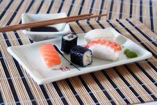 Sushi, Soy Sauce And Wasabi On The Table-cloth Royalty Free Stock Images