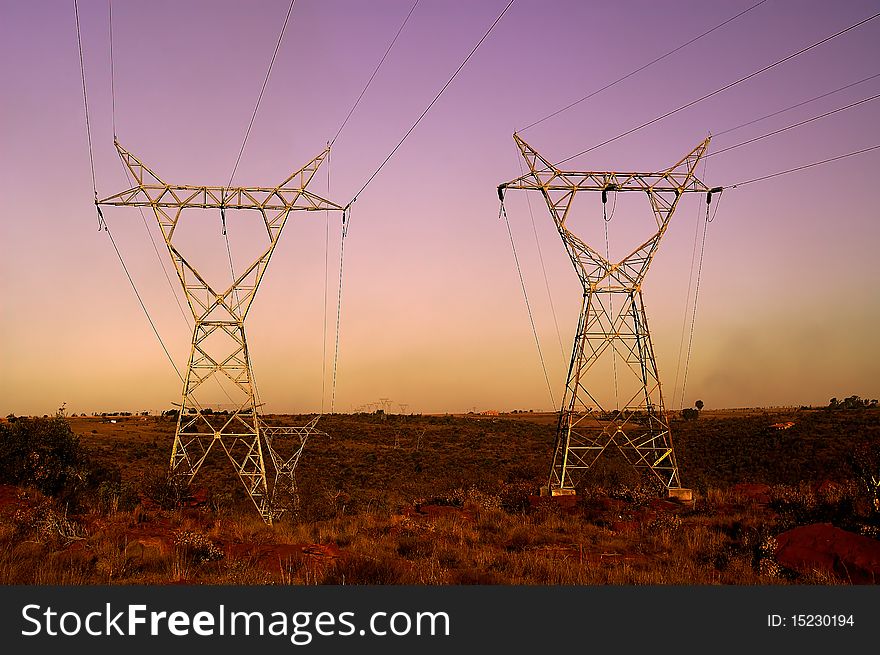 Sunset landscape with two Electrical Pylons