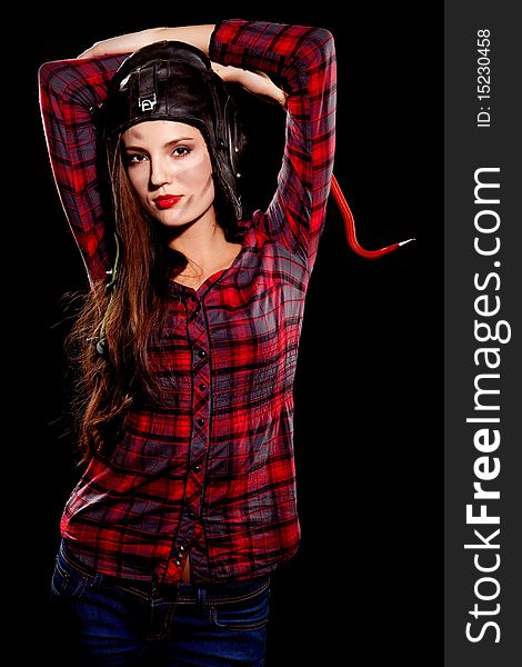 Young beautiful woman in cell shirt with red crowbar. Young beautiful woman in cell shirt with red crowbar