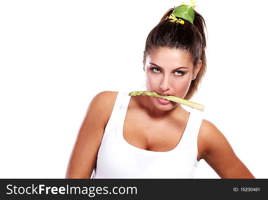 Woman with fresh rgeen asparagus in her mouth. Woman with fresh rgeen asparagus in her mouth