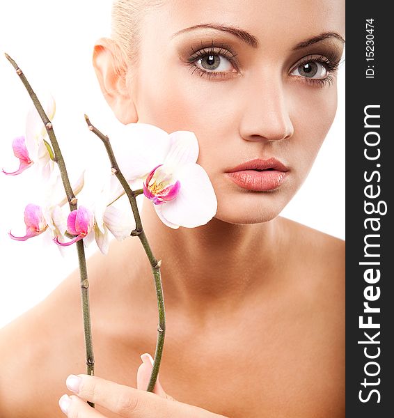 Young beautiful blond woman with white orchid. Young beautiful blond woman with white orchid