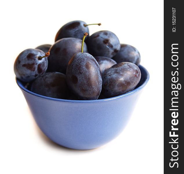 Plums On Blue Plate