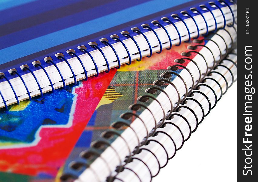 Colored notebooks on white background