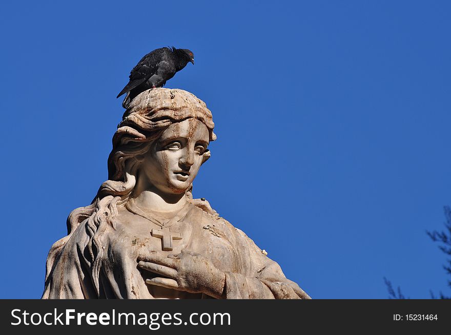 Statue of Mariana Pineda with a pigeon. Mariana Pineda was a martyr during the Spanish Civil War. Statue of Mariana Pineda with a pigeon. Mariana Pineda was a martyr during the Spanish Civil War.