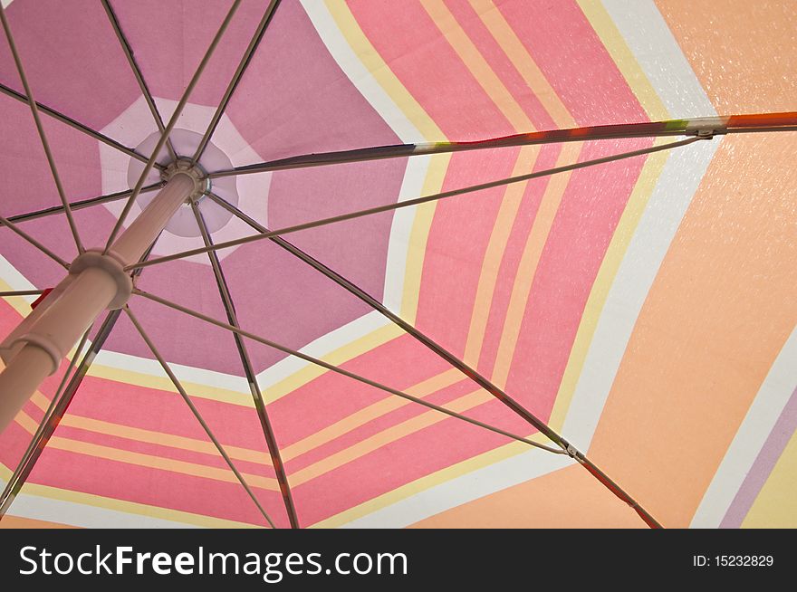 Under of colorful beach umbrella