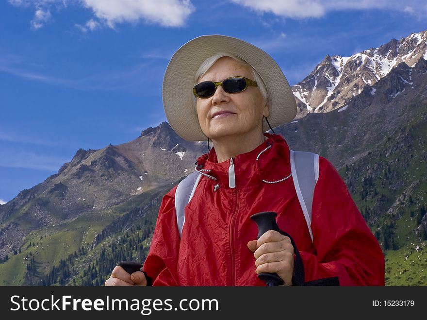 Old women with mountains flowers. Old women with mountains flowers