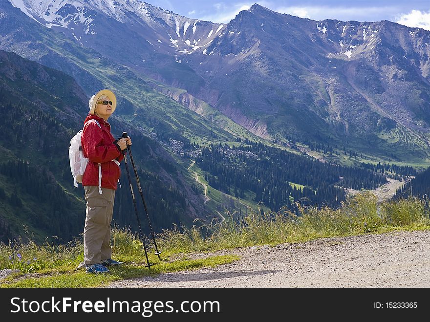 Old women with mountains flowers. Old women with mountains flowers