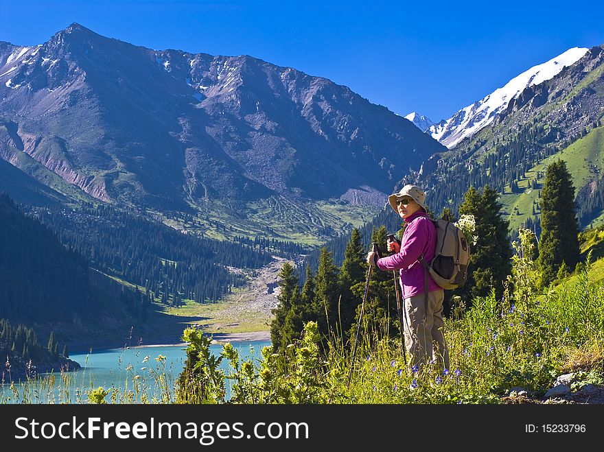 Old women with mountains flowers. Old women with mountains flowers