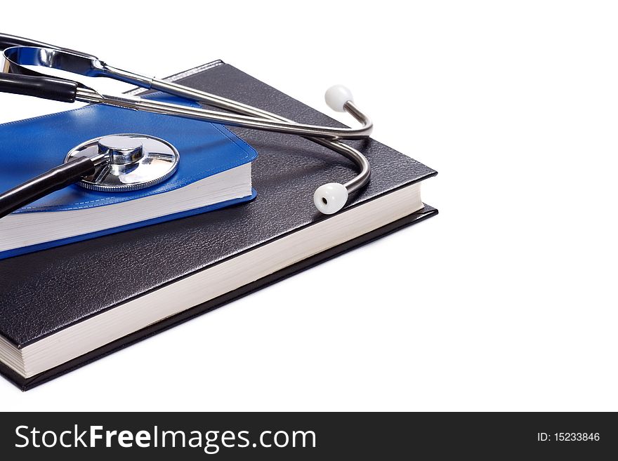 Isolated black book and stethoscope