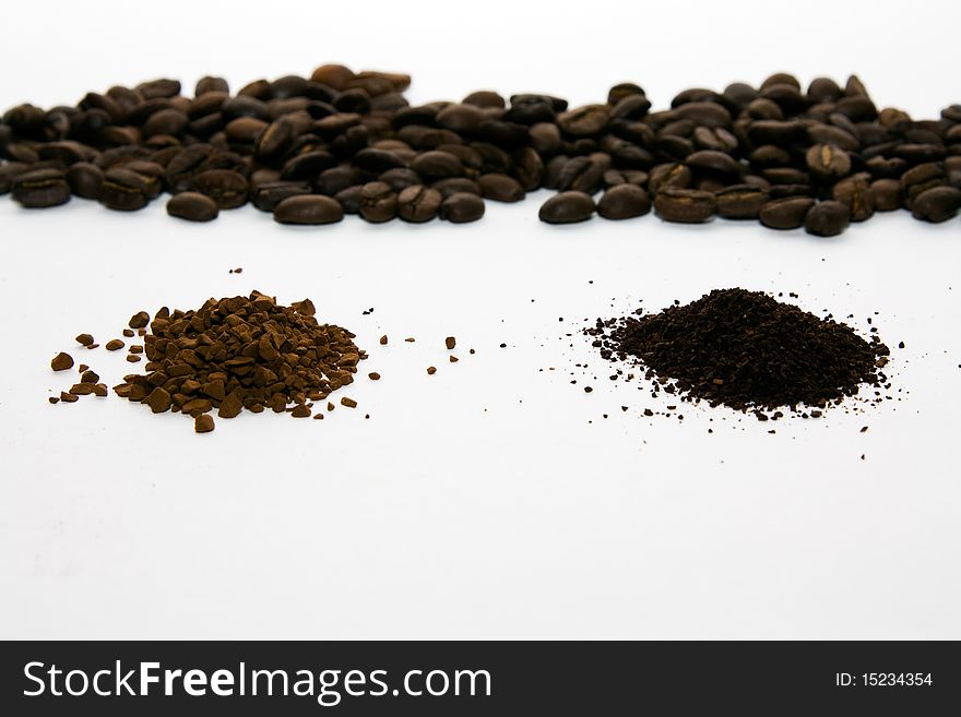 Grains of fried coffee in grains near to mill and instant coffee. Grains of fried coffee in grains near to mill and instant coffee
