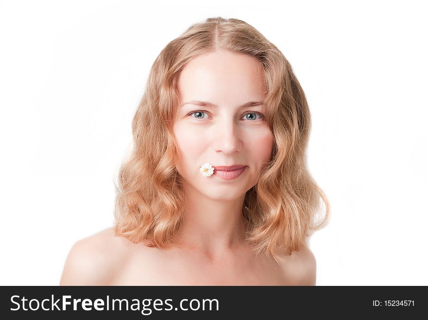 Portrait of a fresh and beautiful woman with daisies between her lips. Portrait of a fresh and beautiful woman with daisies between her lips