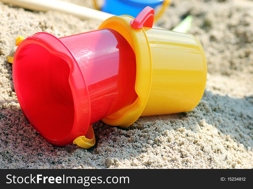 Toys left lying in the sand