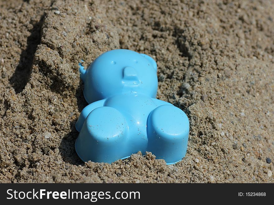 Toys left lying in the sand