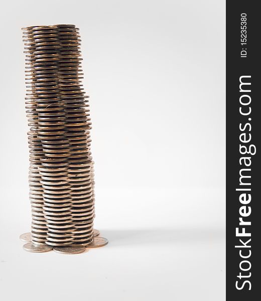 Tower of money on white background