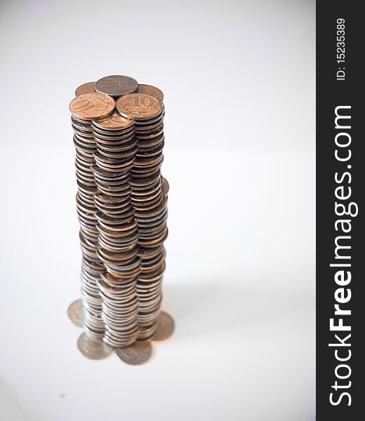 Tower of money on white background