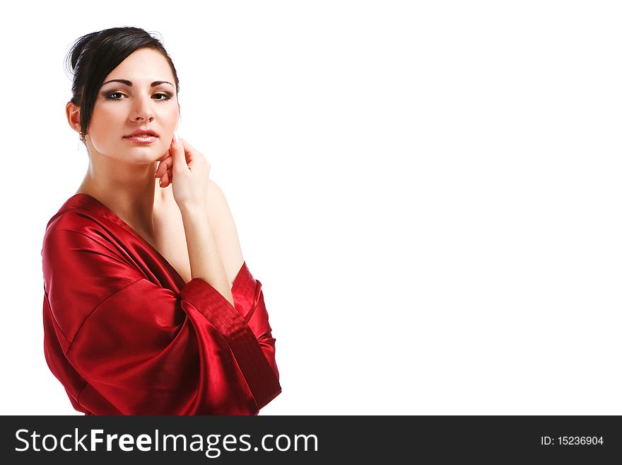 Picture of charming young woman in red gown on white background.
