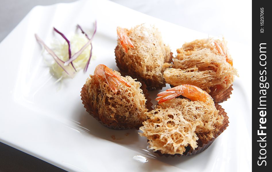 Fried shrimp with decoration in the dish.