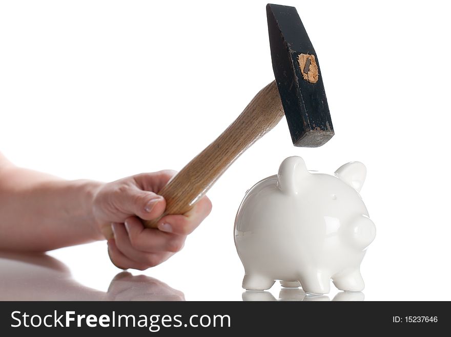 Piggy Bank and a hammer isolated on a white backgorund