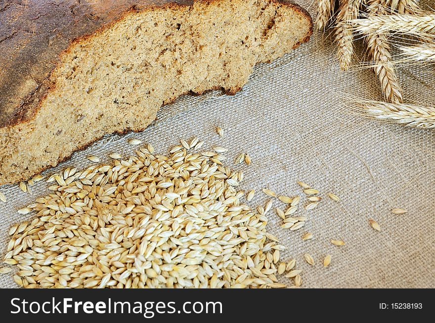 Bread and cereals on the burlap background