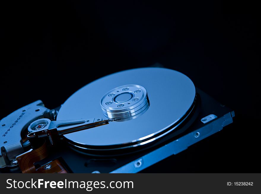 Open hard disk drive closeup. Open hard disk drive closeup