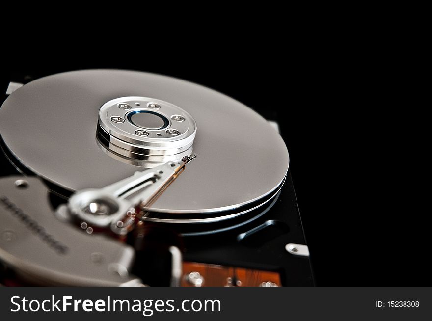 Open hard disk drive closeup. Open hard disk drive closeup