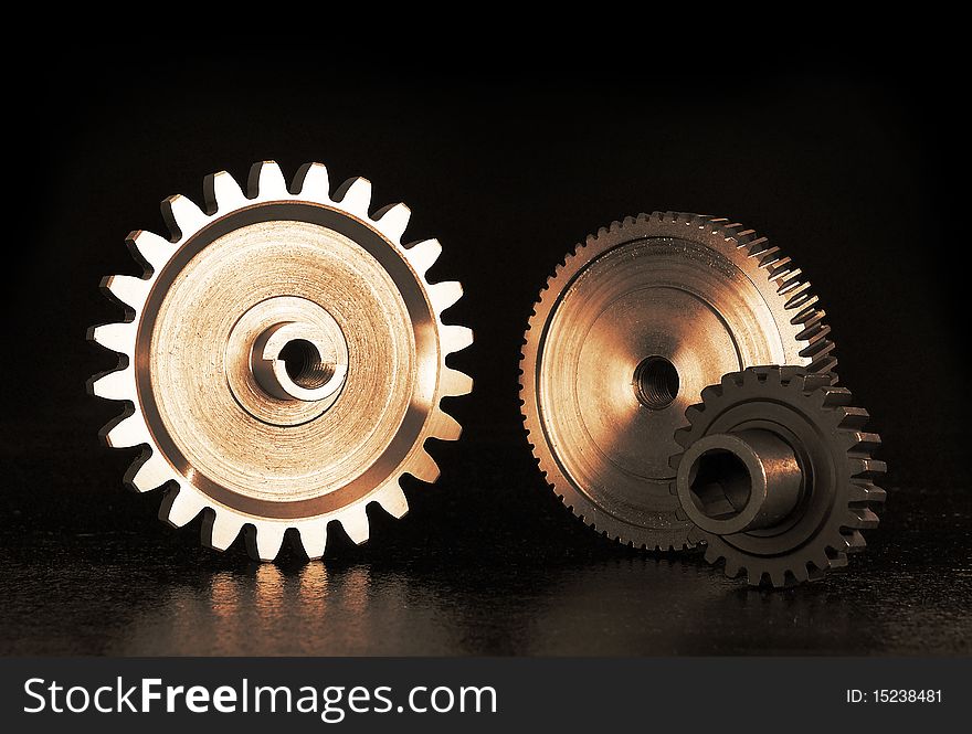 Still life of gears on black background
