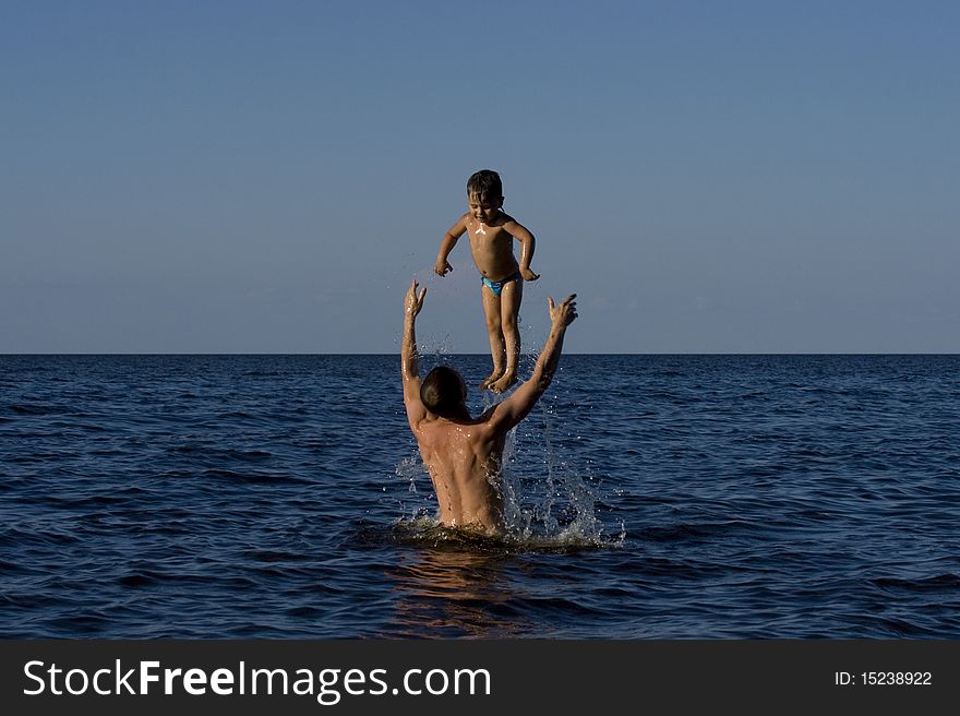 FATHER HOLDING BABY UP HIGH. FATHER HOLDING BABY UP HIGH