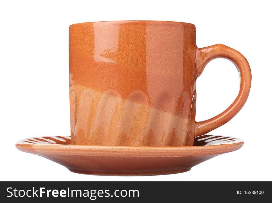 Ceramic cup of the average size, brown colour for tea or coffee with a saucer.