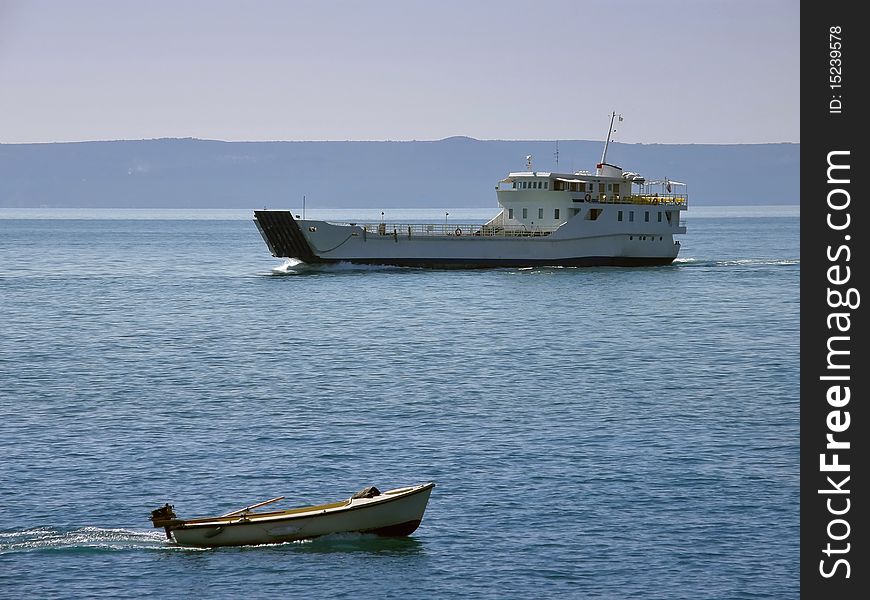 Ship traffic in Adriatic sea . Two ships, catamaran and small boat in different directions, traveling by sea.