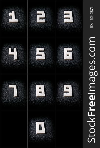 Collage of digits from 1 to 0 which are built from lumps sugar in dark tone. Collage of digits from 1 to 0 which are built from lumps sugar in dark tone