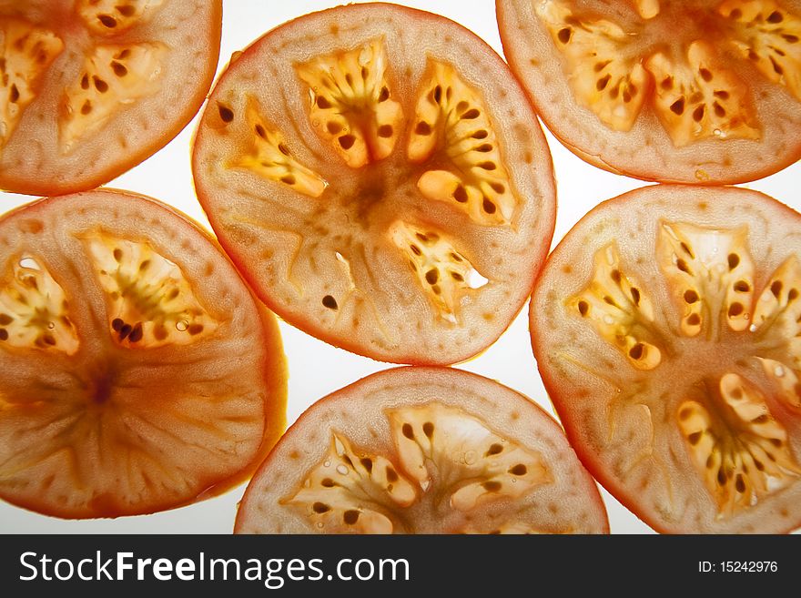 Slices of tomato isolated over the white background