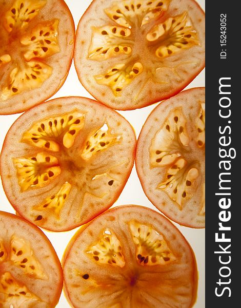 Slices of tomato isolated over the white background