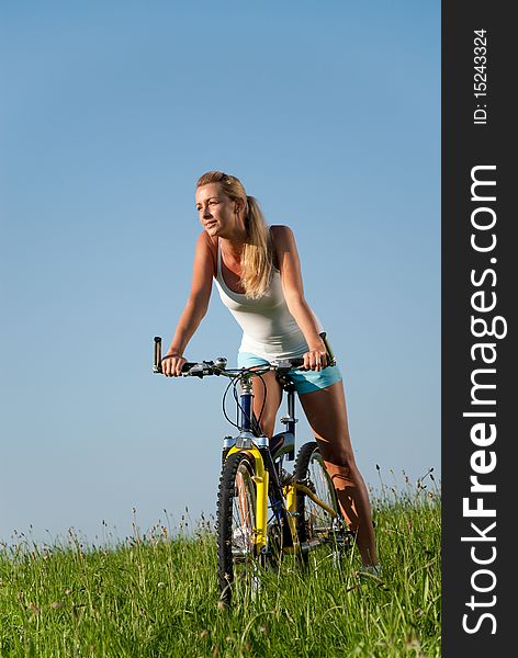 Young woman cycling in her spare time. Young woman cycling in her spare time