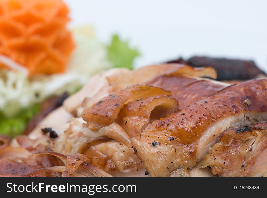 Roasted chicken decorate with carrot and vegetable close up