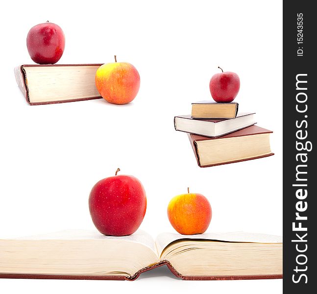 Set of the thick books and apples on a white background
