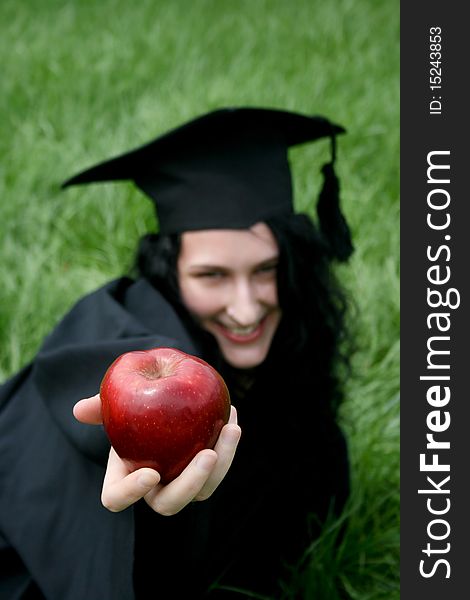 Young smiling caucasian student with apple