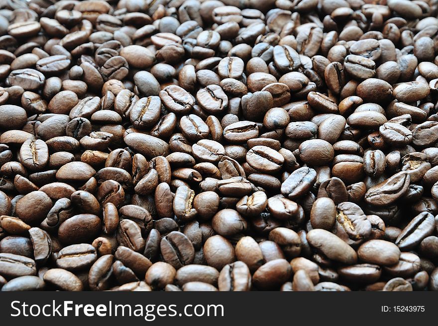 Background of roasted beans of black coffee. Background of roasted beans of black coffee