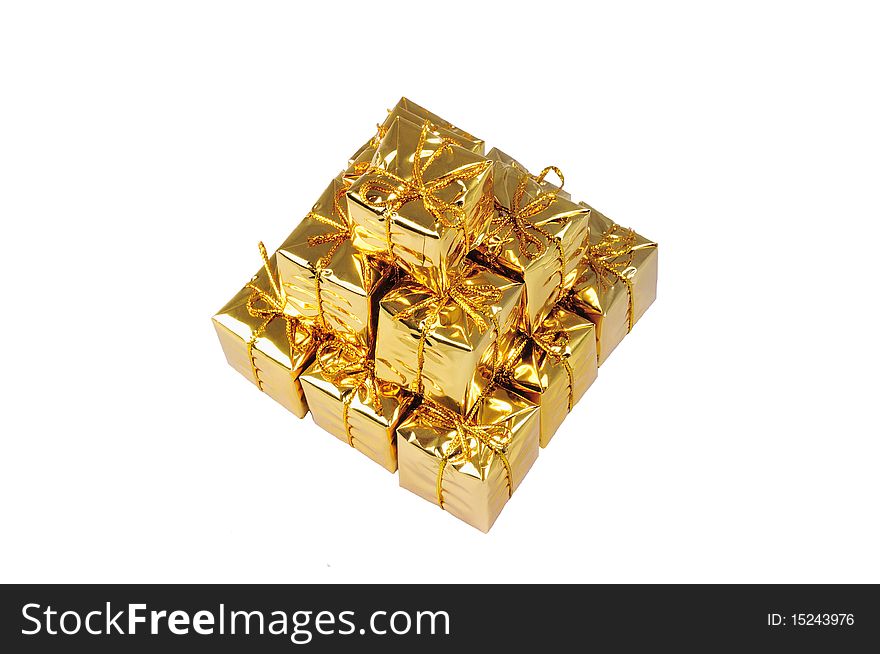 Isolated pyramid of small yellow gifts on white. Isolated pyramid of small yellow gifts on white