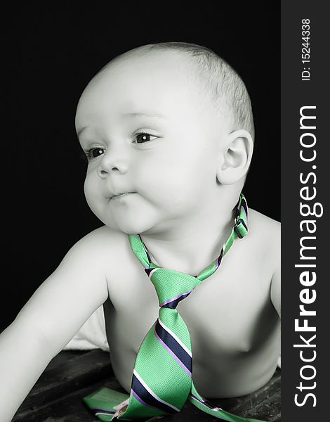 Cute caucasian baby wearing just a tie and diaper. Cute caucasian baby wearing just a tie and diaper