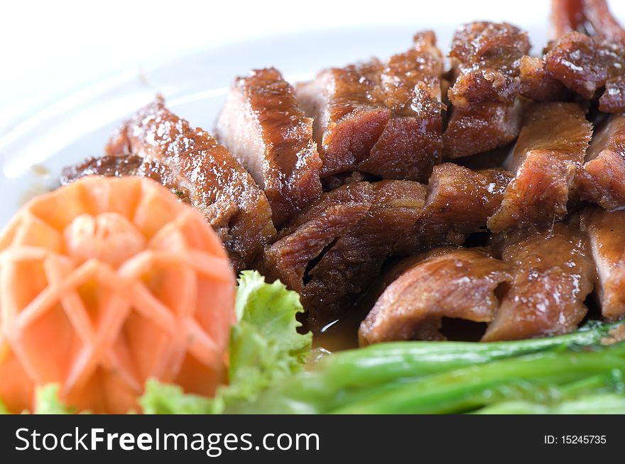 Chinese baked sliced pork decorate with carrot and vegetable