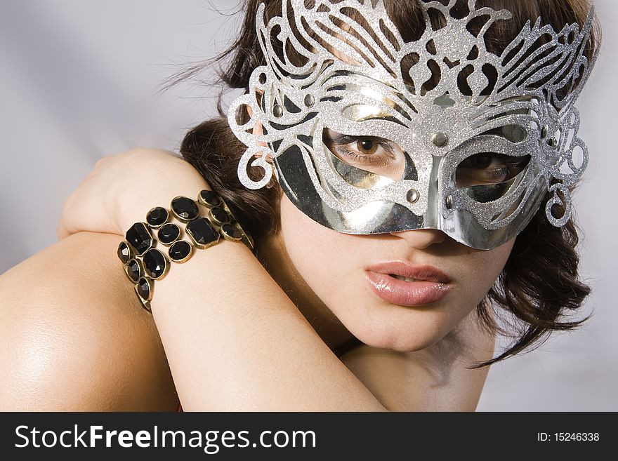 Portrait of attractive beautiful young woman wearing carnival mask. Portrait of attractive beautiful young woman wearing carnival mask