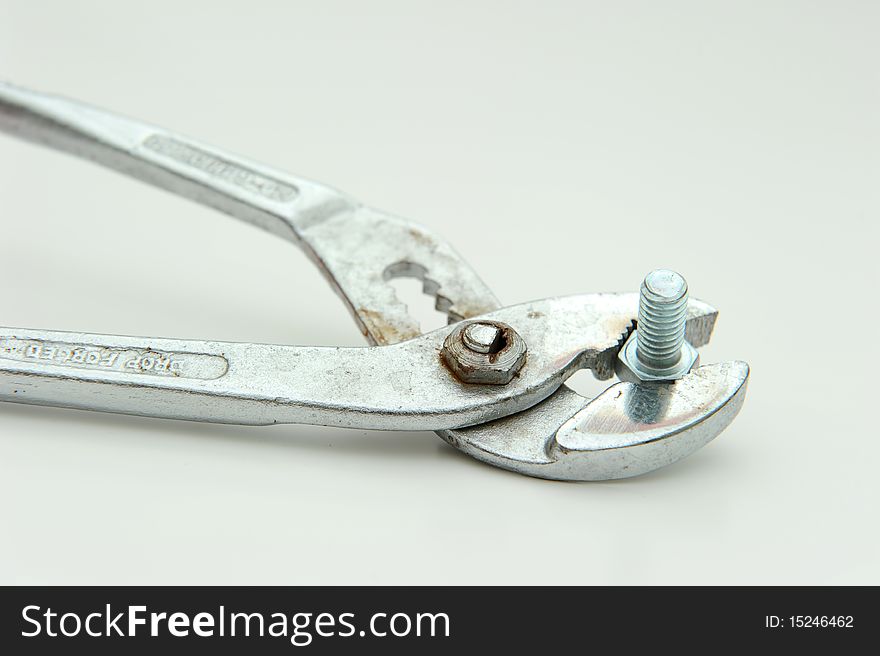 An used plier and on white background. An used plier and on white background