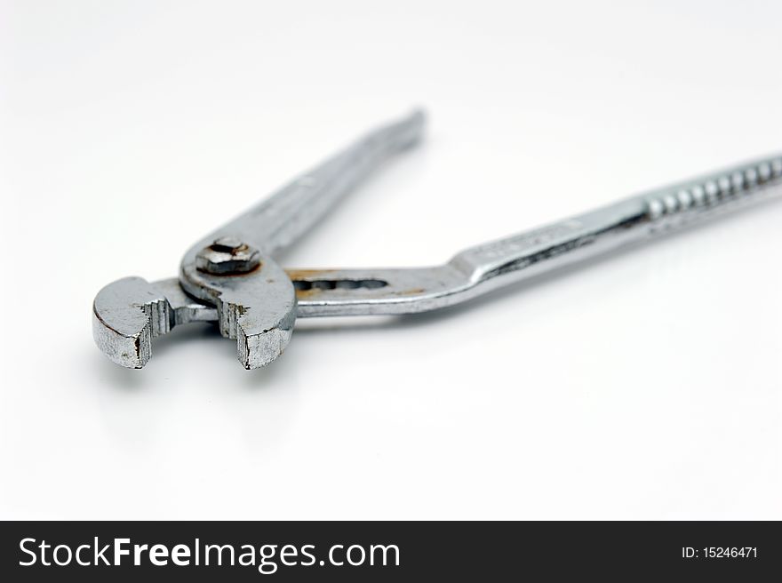 An used plier on white background. An used plier on white background.