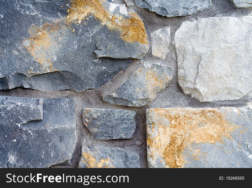 A close up of a stone and mortar wall. A close up of a stone and mortar wall