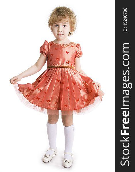 The little girl in dressing-up dress full Length. On a white background. The little girl in dressing-up dress full Length. On a white background.