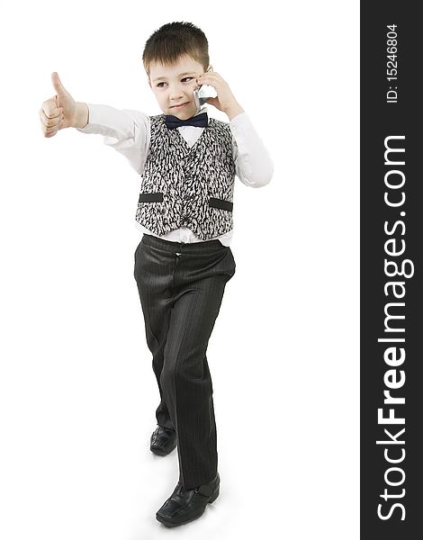 Serious boy with thumbs up on white background. Serious boy with thumbs up on white background