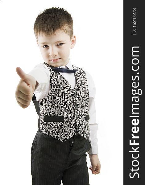 Serious boy with thumbs up on white background. Serious boy with thumbs up on white background